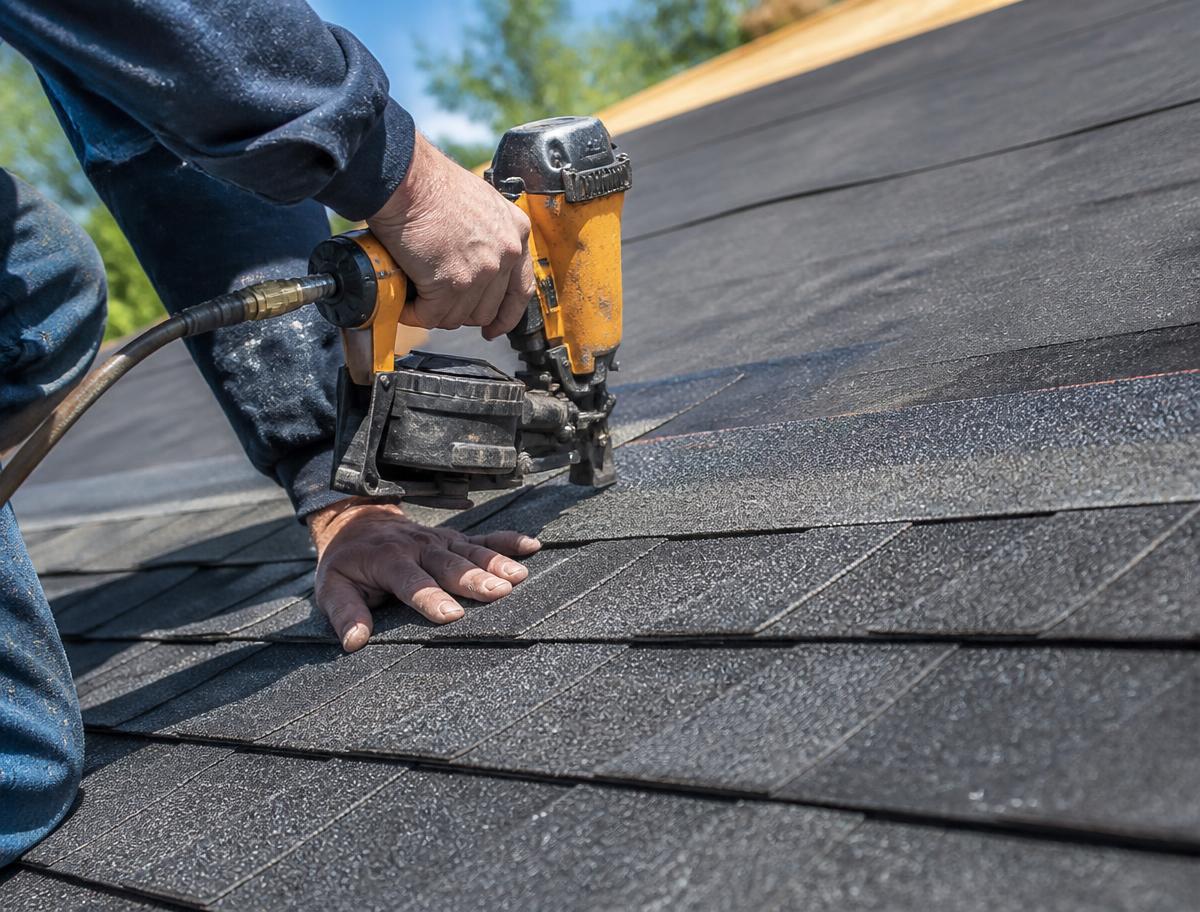 Architectural asphalt shingles being installed